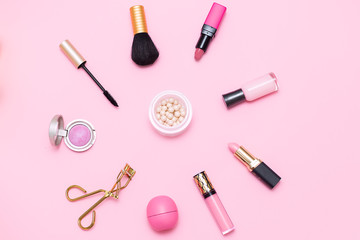 Obraz na płótnie Canvas Makeup brush and pink cosmetics. flat lay