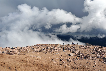 Clouds rise up to surround Pikes Peak in the mountains of Colorado