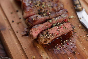 Filetsteak - Rumpsteak on a wooden plate