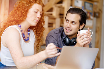 Two young people in office
