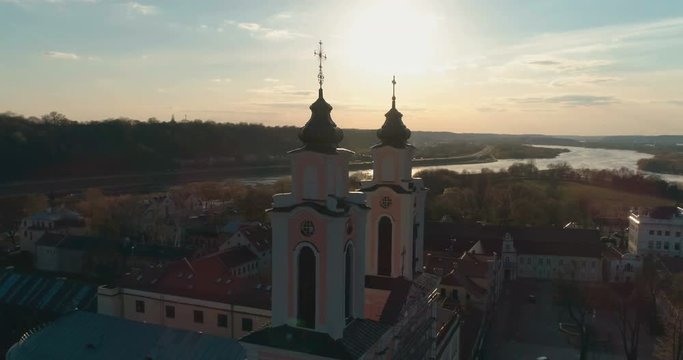  Aerial. Course lock drone shot around Church of St. Francis Xavier and Town Hall above square in Kaunas downtown, Kaunas, Lithuania
