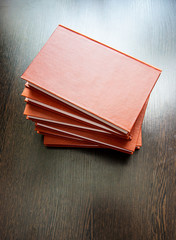 Books on a dark wooden table