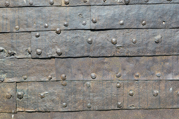Background of iron laminations fastened with nails