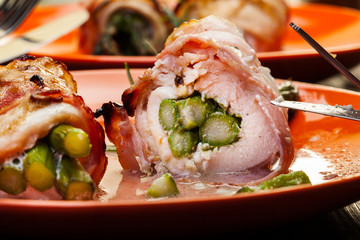 Baked fresh asparagus wrapped in chicken and bacon