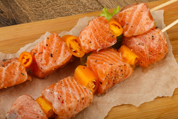 Raw salmon skewer