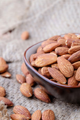 Almonds on sackcloth background