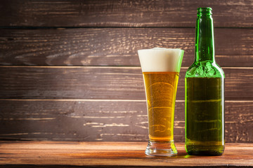 Glass of beer and beer bottle