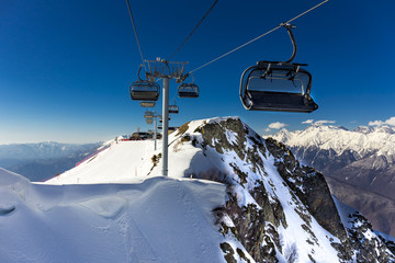 Scenery top view on winter mountains from ski resort Gorky Gorod