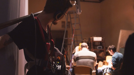 Sound engineer working on the independent cinema production - film set - obrazy, fototapety, plakaty