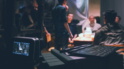 Naklejka premium Director, cinematographer and actors working on the cinema -Film set