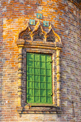 Ornate window on exterior decor of St. John the Baptist Church