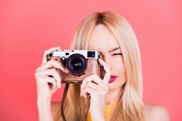 Pretty girl reporter with retro camera