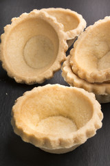 small butter pastry tartlets on slate
