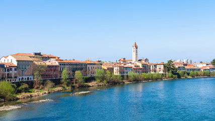 Fototapeta na wymiar waterfront of Adige river in Verona city in spring