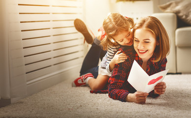 Happy mother's day! Daughter gives her mother an postcard