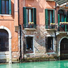 Fototapeta na wymiar urban house on waterfront of canal in Venice