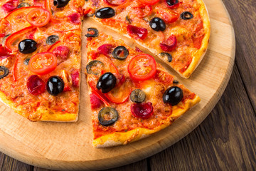 Delicious pizza with salami, mushrooms and olives