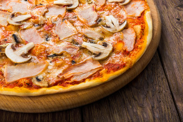 Delicious pizza with mushrooms and smoked chicken