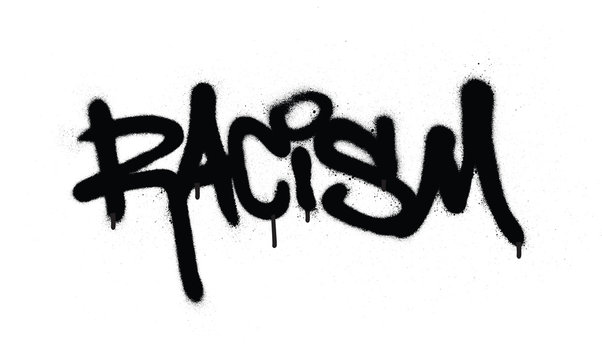 graffiti racism word sprayed in black over white