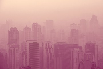 Low visibility caused by pollution problem in urban area during sunset, Bangkok, THAILAND.