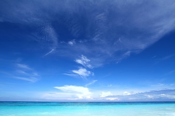 Fototapeta na wymiar Beautiful tropical seascape with clear blue sky and soft white clouds. Tachai island, Andaman sea, Thailand