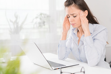 Young woman is tired and feels stressed out.