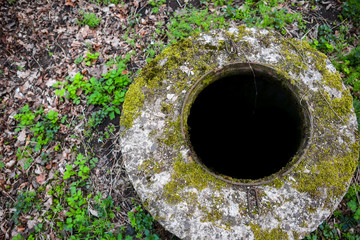 old and abandoned manhole well