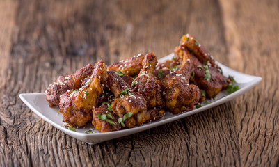 Chicken wings. Fried chicken wings in white bowl garlic dressing ketchup and potato fries.