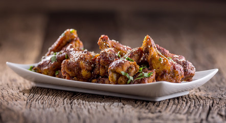 Chicken wings. Fried chicken wings in white bowl garlic dressing ketchup and potato fries.