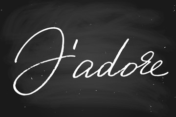 J'adore. I adore in French. Handwritten text, chalk on a blackboard, vector. Each word is on the separate layer