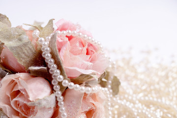 Fototapeta na wymiar Bouquet of pink Roses with pearls
