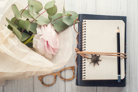 Open blank notebook, bouquet