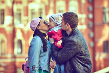 Happy family having weekend in summer park