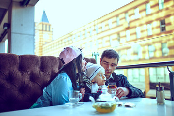 Happy family having weekend in summer park