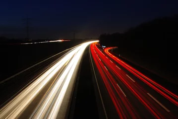 Poster Nachtaufnahme Autobahn - Abblendlicht in der Nacht  © pixeldeus