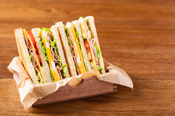 Delicious toast sandwich with ham, cheese, egg and vegetables.