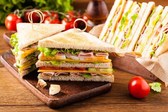 Delicious toast sandwich with ham, cheese, egg and vegetables.