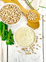 Flour chickpeas in white bowl with peas on board top