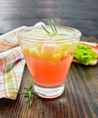 Lemonade with rhubarb and rosemary on table