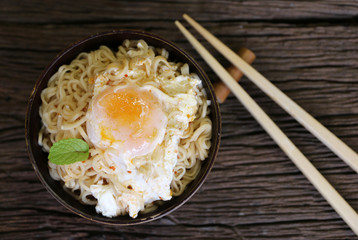 noodle in bowl on wood background top view
