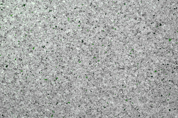 Background of a concrete light gray wall and multi-colored gravel with a texture. Horizontal frame