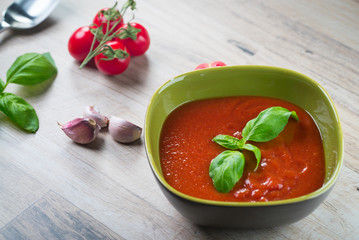 fresh tomato soup in a white bowl