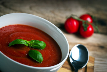 fresh tomato soup in a white bowl