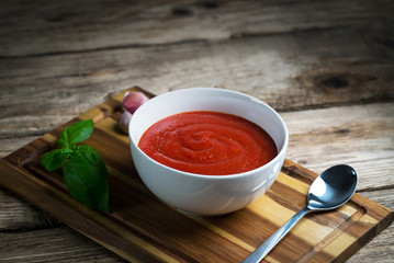 fresh tomato soup in a white bowl