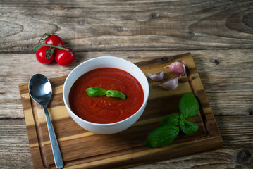 fresh tomato soup in a white bowl