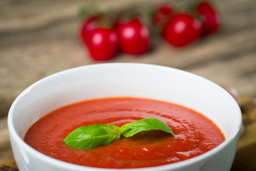 fresh tomato soup in a white bowl