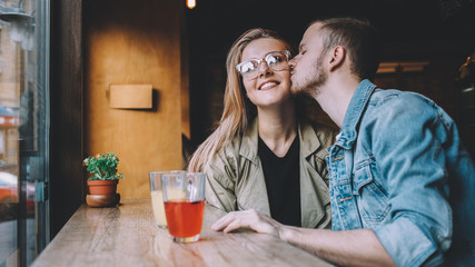 Portrait of beautiful young couple in love at a coffee shop.