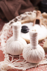 Spa massage with towel and herbal balls