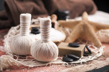 Spa massage with towel and herbal balls
