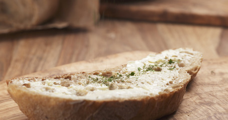 herbs on rustic bread with butter, 4k photo